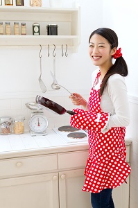 a woman smiling in a kitchen