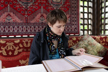 a woman reading a menu